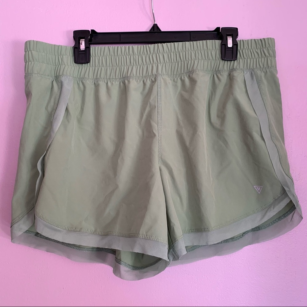 Green tulip hem running shorts